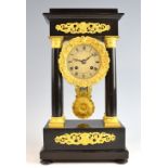 French ebonized and gilt mounted portico clock, the two train movement marked Streel. 38cm high .