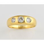 Old cut diamond ring, three old cut diamonds, estimated total weight 1.00 carat, gypsy set in yellow