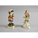 Two 19th century Derby figures of a man and woman, the man with sticks in his hand, the woman with
