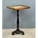 19th century ebonized and gilt metal mounted marble topped and galleried chess table, on turned