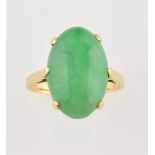 Jade ring, oval cabochon cut jade, estimated weight 11.34 carats, claw set in yellow metal testing