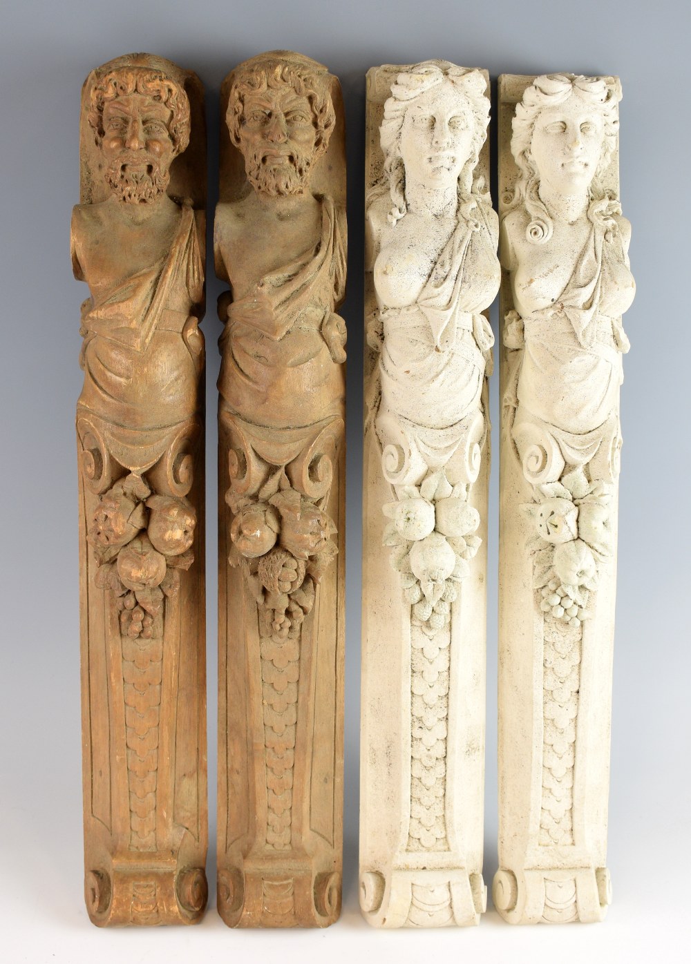 Two pairs of carved wood caryatid figures, 62cm high.