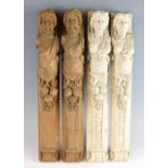 Two pairs of carved wood caryatid figures, 62cm high.