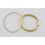 Two gold bangles, a hinged gold bangle 9 ct, and rope twist bangle tested as 14 ct . 9 ct 16.2 grams