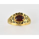 18th C mourning ring set with faceted garnet in gold and black enamel mount enamel, with engraved