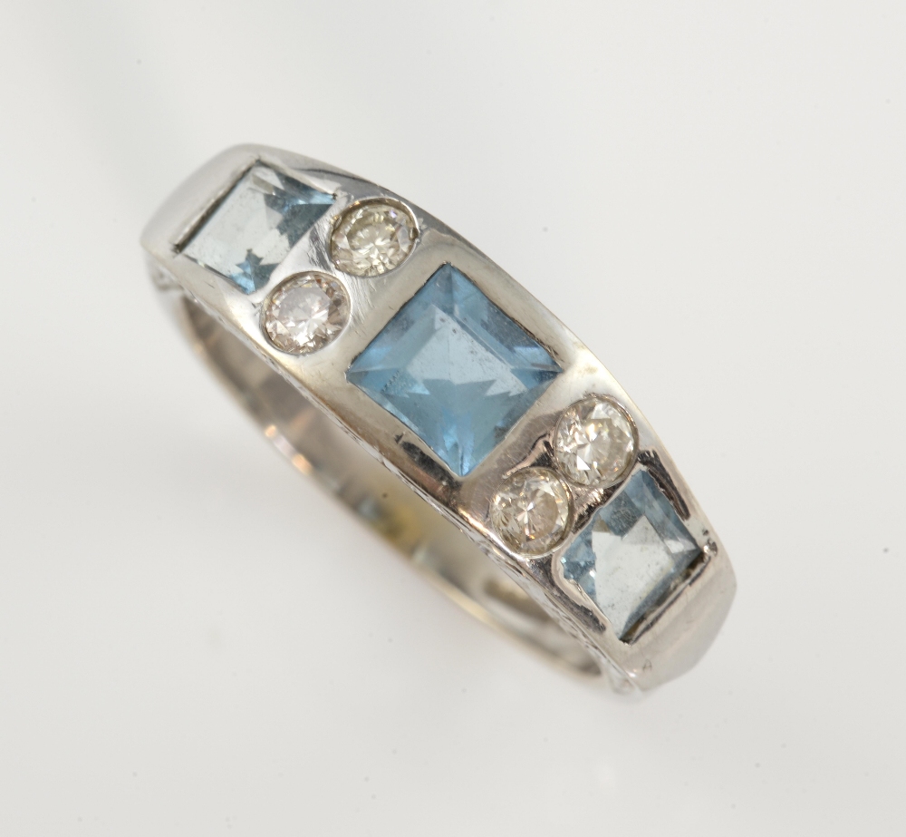 Aquamarine and diamond dress ring, three aquamarines set with four round brilliant cut diamonds,