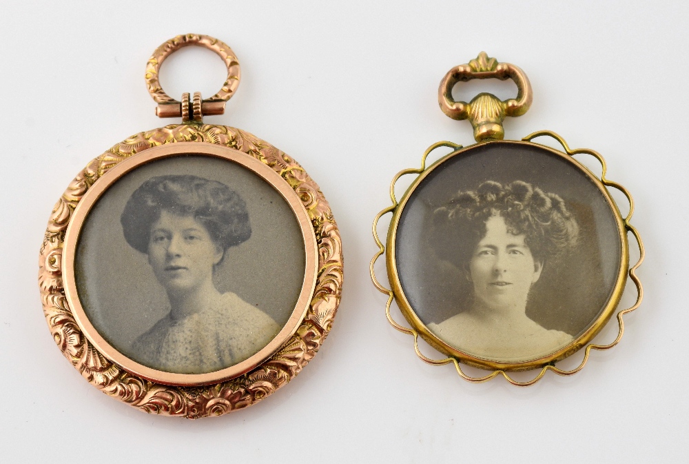 Two 19th C double sided open lockets, one with scroll decorated border measuring approximately 3.5cm