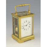 Brass repeating carriage clock the dial inscribed Edward and Sons Paris. 18cm with earlier