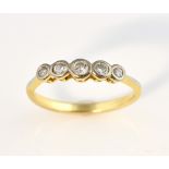 Diamond set ring, five graduated round brilliant cut diamonds, mounted in yellow metal testing as 14