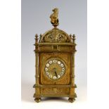 Brass mantel clock, the dial with white enamelled cartouches and Roman numerals, movement by