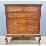 19th Century oak chest of two short and three long graduated drawers on base with cabriole legs, 117