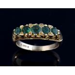 Victorian style ring set with five emeralds, 9 ct gold London 1989, ring size J 1/2 . Gross weight