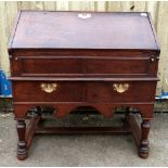 Oak bureau with fall flap over two drawers, on turned supports and stretchered base, 93cm x 89cm .