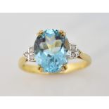 Blue topaz and diamond Art Deco style ring, central oval stone and diamond set shoulders, size P1/2,