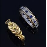 Two gold rings, knot ring in 18 ct gold, ring size N and an eternity ring with blue and white