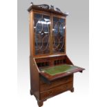 George III mahogany bureau bookcase, with fret carved cornice and two astragal glazed doors above