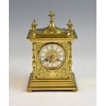 French brass mantel clock, the silvered dial with Roman numerals and twin train movement striking on