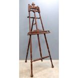 Early 20th century artist's oak easel, with turned decoration, 176cm high . structurally