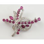 Vintage 1970's ruby and diamond brooch, looped ribbon motif set with Swiss cut diamonds, intersected