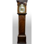 18th century Walnut long case clock by Francis Reynolds, Kensington, 12 inch arched brass dial