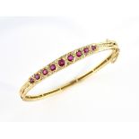 Victorian style gold bangle set with rubies and diamonds, in 9 ct gold, 6 cm inner width, with