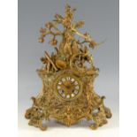 Early 20th century brass cased clock with twin train movement, blue Roman numerals on white enamel