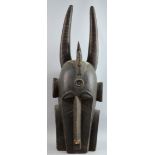 Large tribal carved wooden head with horns, 85 cm high PROVENANCE: Acquired by the owner's family in