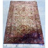 Persian cream ground silk rug with floral pattern and borders, 170cm x 102cm,.