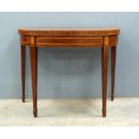 Mahogany and crossbanded D-end foldover card table on square tapering supports and spade feet,