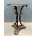 Early 20th century Coalbrooke style cast metal table on shaped supports triangular base to scroll