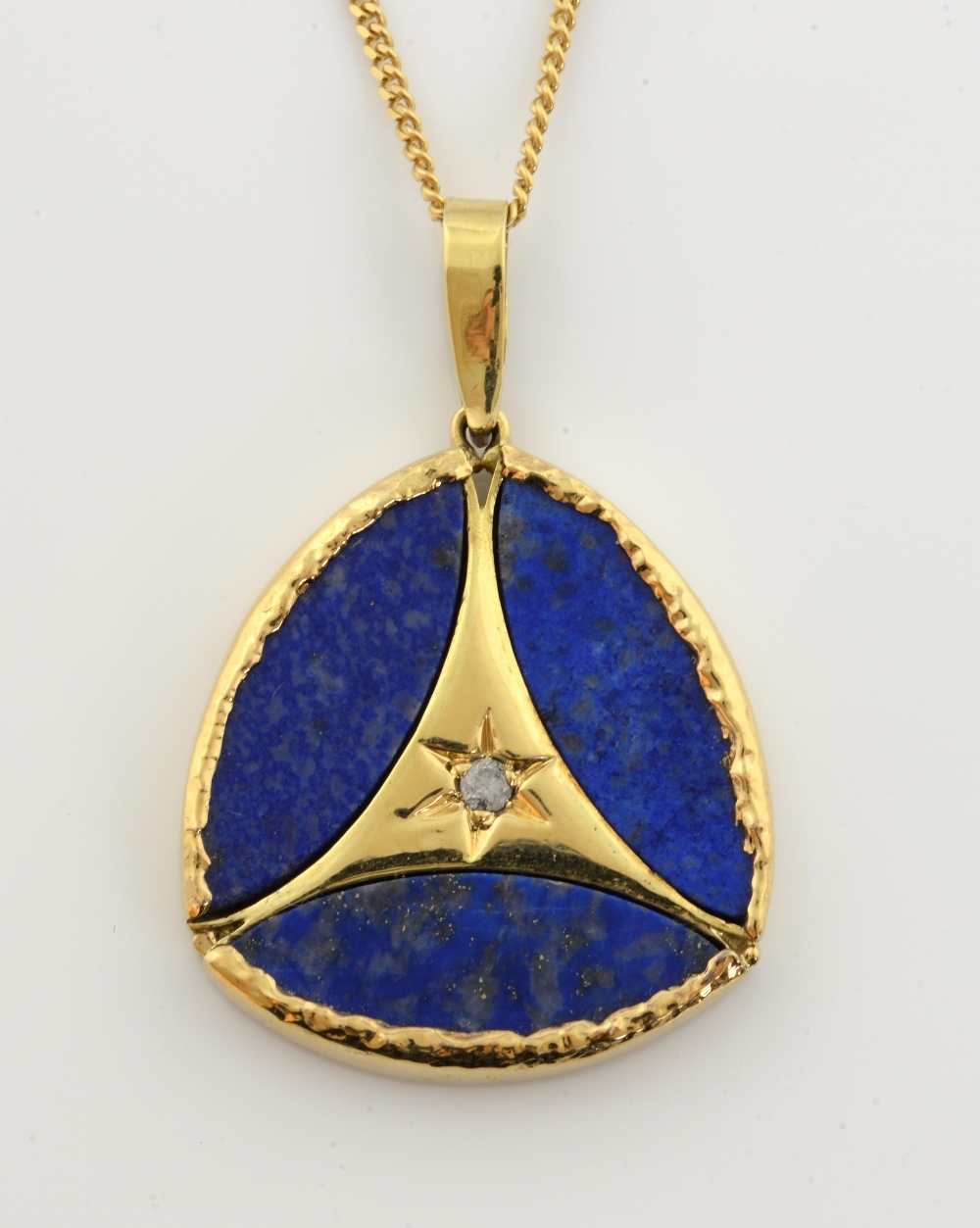 Lapis Lazuli and diamond pendant, round cut diamond, with three marquise shaped plaques, set in 18ct