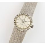 Omega Ladies dress watch. set in a polished 18ct white gold oval case with diamond set bezel,