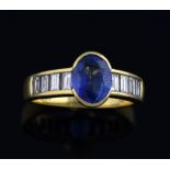 Sapphire and diamond ring, oval mixed cut sapphire of approximately 2.15 carats and channel set