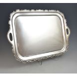 George V silver twin-handled tray with serpentine rim, by Walker & Hall, Sheffield, 1928, 78.5oz,