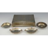 George VI silver cigarette box with engine turned decoration on four shaped feet, maker's mark