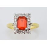 Fire opal and diamond set ring, set with central emerald cut stone, of approximately 1.00 carat