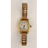 Ladies wristwatch, tonneau shaped dial with Arabic numerals and subdial, 18ct yellow gold case,