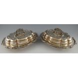 Pair of silver plated entree dishes and covers with lobed bodies, moulded scrolling, foliate and