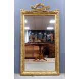 Empire style gilt gesso framed wall mirror, 155cm x 84cm .