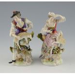 Pair of Sitzendorf porcelain figures, modelled as a man and woman with lambs, 20cm high, .