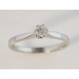 Single stone diamond ring, set with a brilliant cut stone estimated at 0.25 carat, white metal