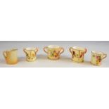 Four Royal Worcester miniature blush ivory loving cups and mug, earliest 1901, highest 4cm, and a