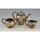 Victorian silver tea service for one, comprising tea pot, cream jug and sugar bowl with rattan