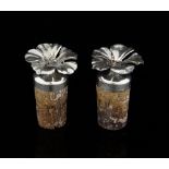 Pair of Sterling silver cork bottle stoppers the silver mounts in the form of flowers, marked '