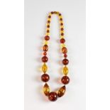 Large bead amber necklace, circular and ovoid beads of heated amber, length 60 cm, 128 grams .