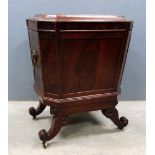 19th century mahogany and cross-banded cellarette of octagonal section on four scroll supports and