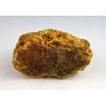 A large piece of raw amber rough weight 1322 grams, max 13.5 x 17 x 9 cm Being sold in aid of