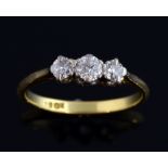 Three stone diamond ring, claw set, in 18 ct gold, total weight estimated at 0.44 carat, ring size N