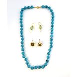 Two pairs of earrings, carved jade and faux pearl drop earrings with gilt metal wires, faux pearl