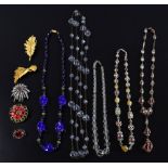 Vintage costume jewellery glass bead necklaces and brooches.
